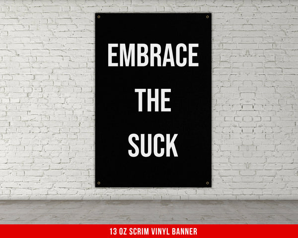a black and white sign that says embrace the suck