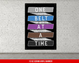 A white, checkered-patterned fabric is rolled up and secured with a gold ring, which is fastened with a gold ring.