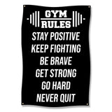 Black banner with white text: Gym rules, stay positive, keep fighting, be brave, get strong, never quit.
