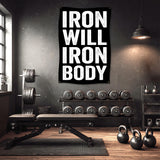 Black banner with "IRON WILL IRON BODY" text hanging in a gym.