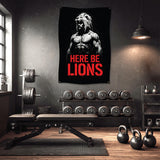 Banner featuring a muscular man with text "HERE BE LIONS" in a gym.