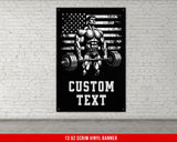 a poster of a man lifting a barbell in front of a brick wall