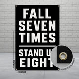 Black banner with white text "FALL SEVEN TIMES STAND UP EIGHT" and grommet detail.