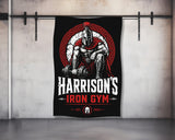 Spartan warrior lifting weights with "Harrison's Iron Gym EST. 2024" logo.