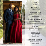 A man and a woman dressed in formal attire are standing together in front of a fountain, with a sign providing information about the photo options available.