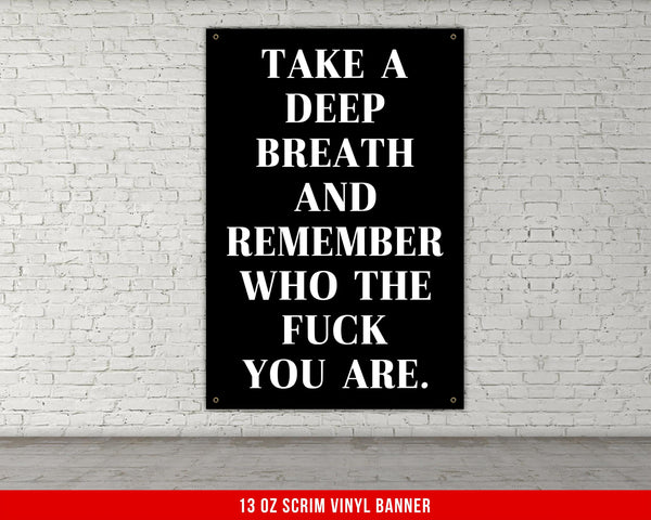 a black and white poster on a white brick wall