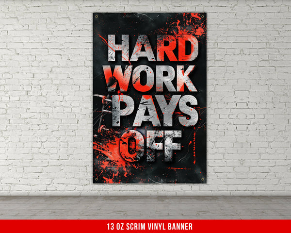 a red and black poster hanging on a white brick wall