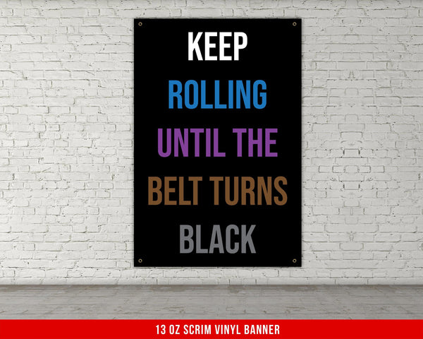 A white, checkered-patterned fabric is rolled up and secured with a gold ring, which is fastened with a gold ring.