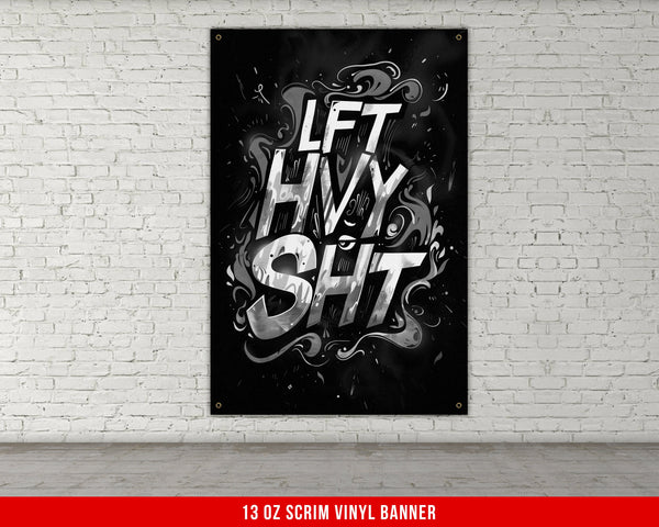 a black and white poster hanging on a brick wall