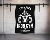 Black and white Iron Gym logo with muscular warrior and "No Excuses" text.