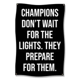 Black banner with white text: "CHAMPIONS DON'T WAIT FOR THE LIGHTS. THEY PREPARE FOR THEM."