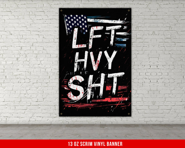 a black and red poster hanging on a white brick wall