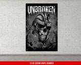 a brick wall with a poster of a skull wearing a helmet