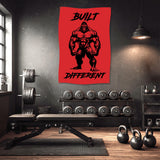 Red banner with black gorilla graphic and "BUILT DIFFERENT" text in a gym.