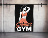 Woman in workout clothes and "Sienna's Gym" logo on black towel.