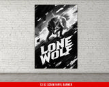 a black and white poster hanging on a brick wall