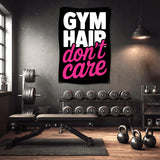 Gym Hair Don't Care banner hangs in a home gym with weights and equipment.